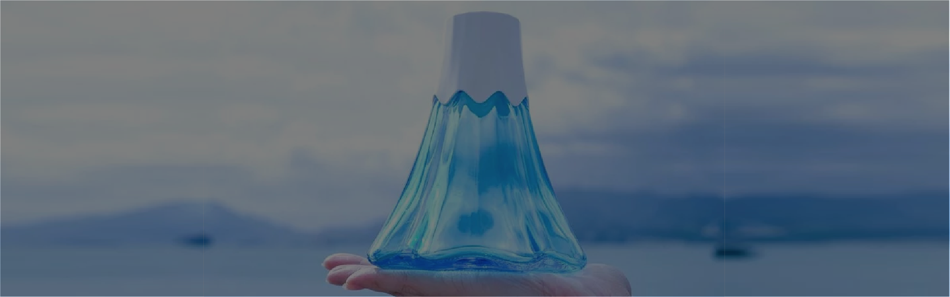 Mount Fuji blue glass water bottle with white cap at Grandmama Store in Hong Kong.