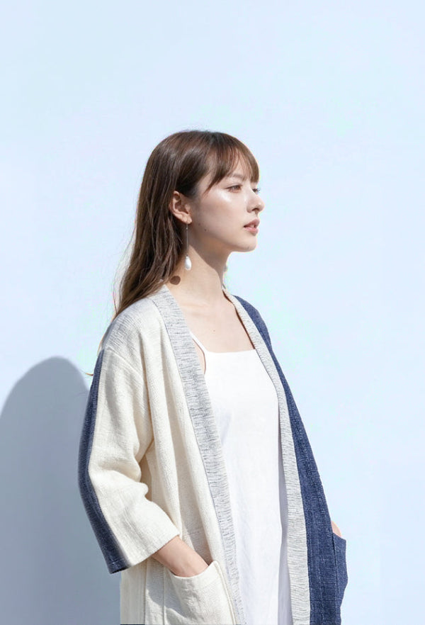 A woman modeling the color-blocked Hand-cranked Kimono in Mt. Fuji colorway at Grandmama Store in Hong Kong.