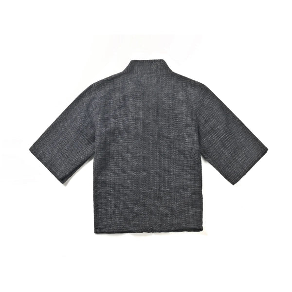 Back view flat-lay of solid charcoal grey Hand-cranked Kimono at Grandmama Store in Hong Kong.