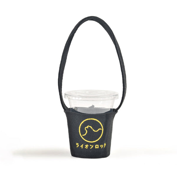 Black fabric Kamon Cup Sleeve with yellow Lion Rock graphic and carrying strap holding a drink cup at Grandmama Store in Hong Kong.