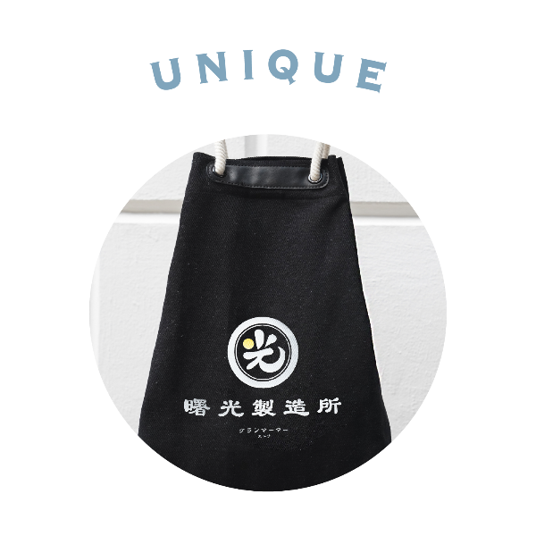 Circular graphic cutout showing the Light of Dawn Sake Bag in Black Denim with white Japanese text at Grandmama Store in Hong Kong.