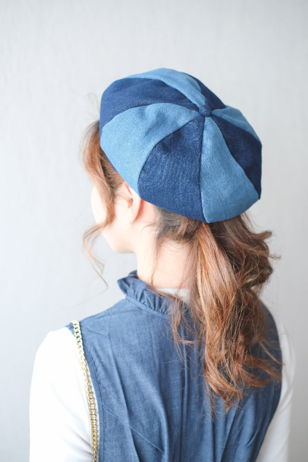 Close-up back view of alternating blue paneled Sunshine Beret at Grandmama Store in Hong Kong.