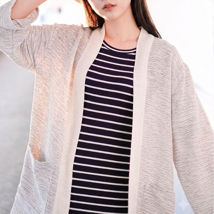 Close-up detail of off-white Hand-cranked Kimono cardigan at Grandmama Store in Hong Kong.
