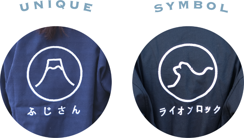 Close-up embroidery circular details for Mount Fuji and Lion Rock crests at Grandmama Store in Hong Kong.