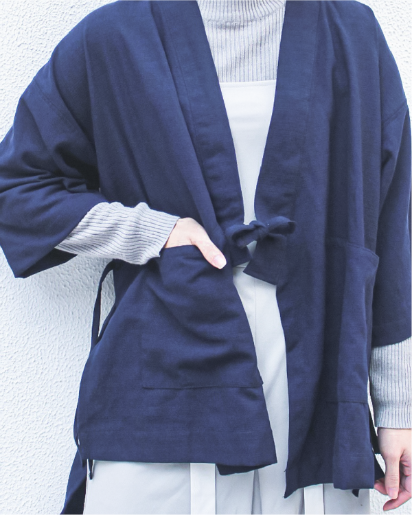 Close-up front detail of a navy blue Kamon Kimono Jacket showing front tie and pocket at Grandmama Store in Hong Kong.