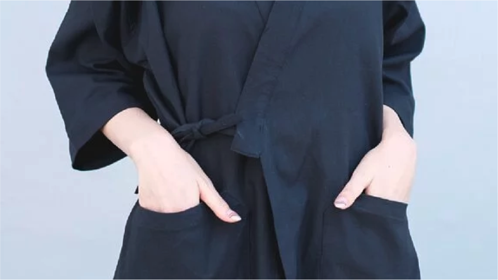 Close-up front view of black Kamon Kimono Jacket-Lion Rock with side tie and patch pockets at Grandmama Store in Hong Kong