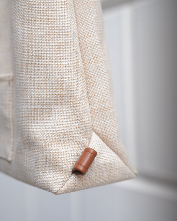 Close-up of bottom corner detail on the Light of Dawn Sake Bag in Linen at Grandmama Store in Hong Kong.