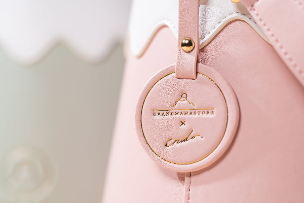 Close-up of pink Mt. Fuji Goen Bag leather charm with Grandmama Store x Crudo collaboration logo at Grandmama Store in Hong Kong.