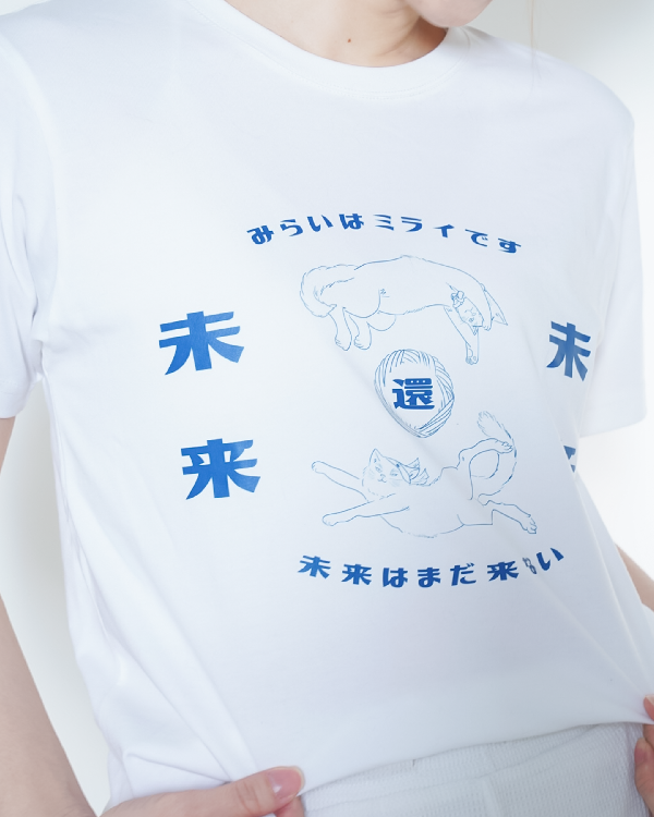 Close-up of the front blue cat graphic print on the white Lazy Cat Tee at Grandmama Store in Hong Kong.