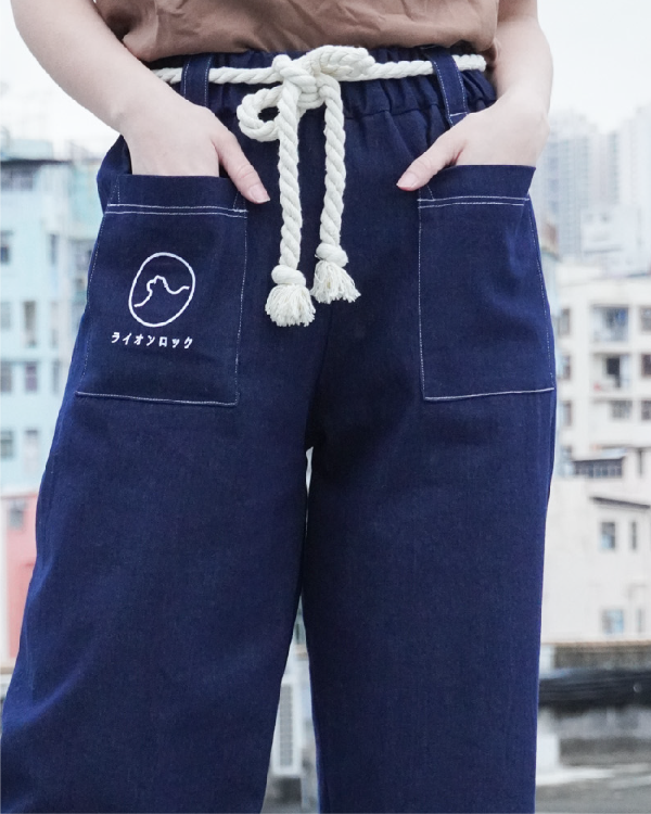Close-up of the front pockets and rope drawstring on the navy Lion Rock Kamon Pants at Grandmama Store in Hong Kong.