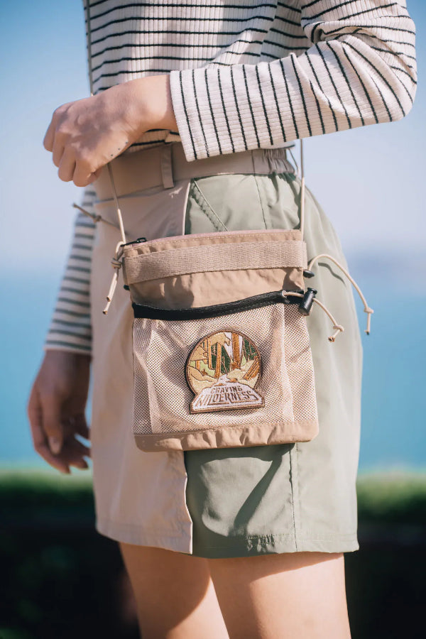Close-up of the light brown Yama Multifunctional Bag with embroidered wilderness patch at Grandmama Store in Hong Kong.