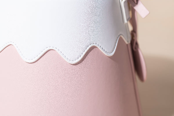 Close-up of white scalloped stitching on the pink Mt. Fuji Goen Bag at Grandmama Store in Hong Kong.