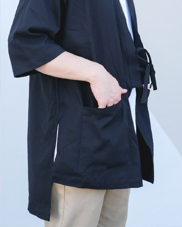Close-up view of front pocket, side slit, and tie closure on navy blue Kamon Kimono Jacket at Grandmama Store in Hong Kong.