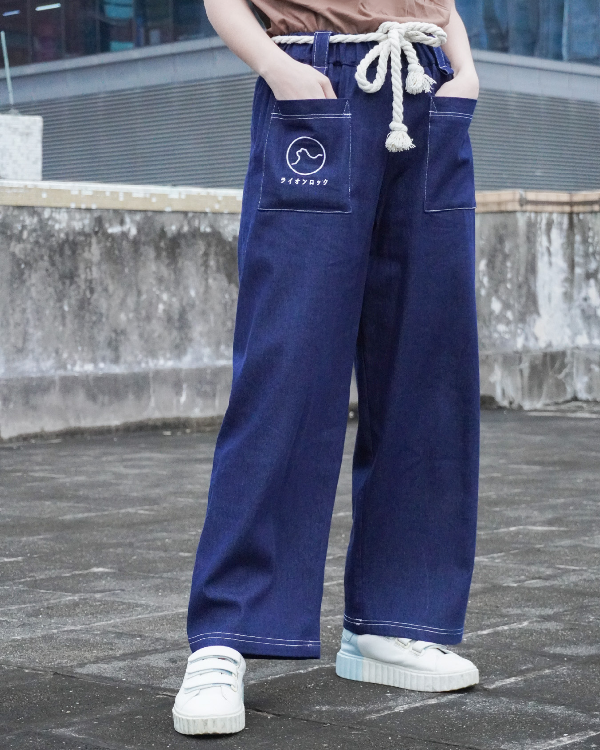 Close-up view of navy blue Kamon Japanese Waist Rope Pants with Lion Rock pocket detail at Grandmama Store in Hong Kong.
