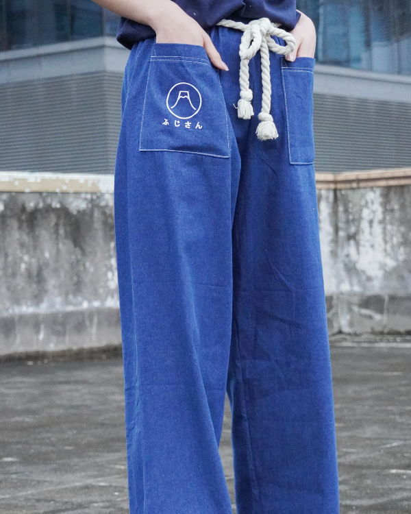 Close-up view of the front pockets and white rope belt on the Oxford blue Mt. Fuji Kamon Pants at Grandmama Store in Hong Kong.