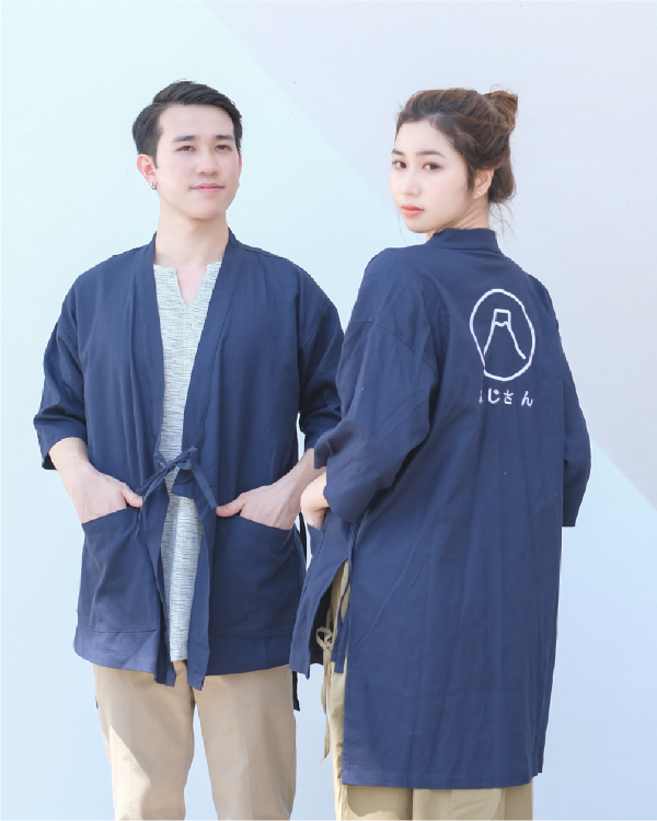 Couple posing in navy blue Kamon Kimono Jackets featuring Mount Fuji back embroidery at Grandmama Store in Hong Kong.