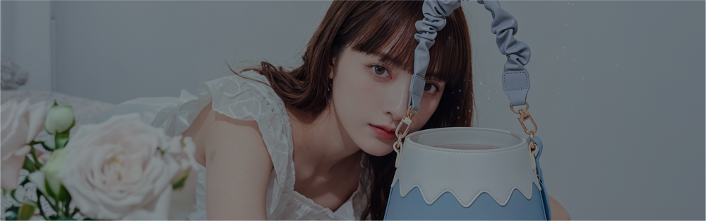 Female model posing with a light blue and white Goen bucket bag at Grandmama Store in Hong Kong.