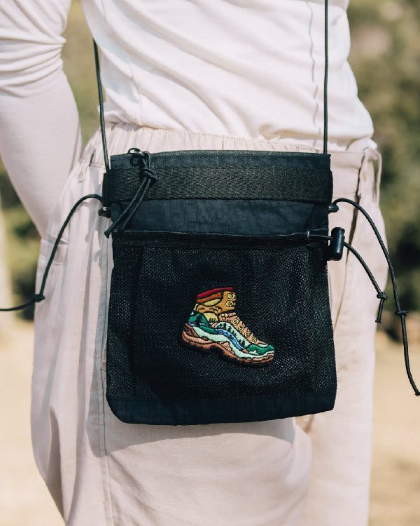 Front view of black Yama Multifunctional Bag worn cross-body at Grandmama Store in Hong Kong.