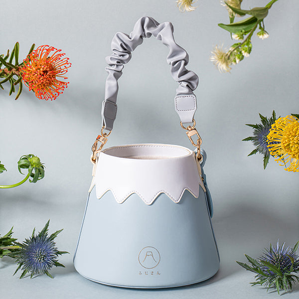 Light blue Mt. Fuji Goen Bag in Snow with scrunchie strap and floating flowers at Grandmama Store in Hong Kong.