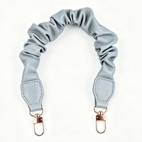 Light blue ruffled scrunchie leather strap accessory with gold clasps at Grandmama Store in Hong Kong.