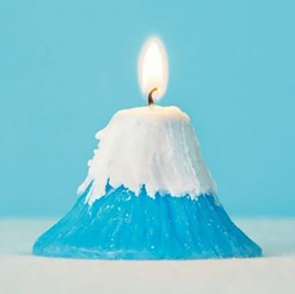 Lit blue Mt. Fuji Candle with snow-capped top at Grandmama Store in Hong Kong