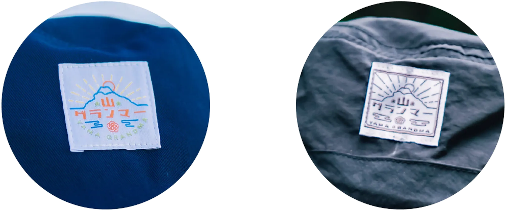 Macro close-up of woven brand logo patches on the Yama Workwear Bucket Hat at Grandmama Store in Hong Kong.