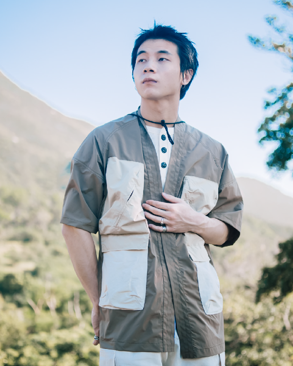 Male model wearing brown Morikawa Yama Kimono Jacket outdoors at Grandmama Store in Hong Kong.