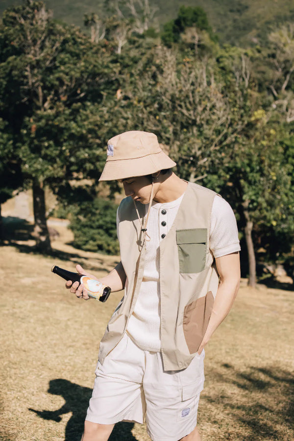 Man wearing the beige Yama Workwear Bucket Hat outdoors at Grandmama Store in Hong Kong.