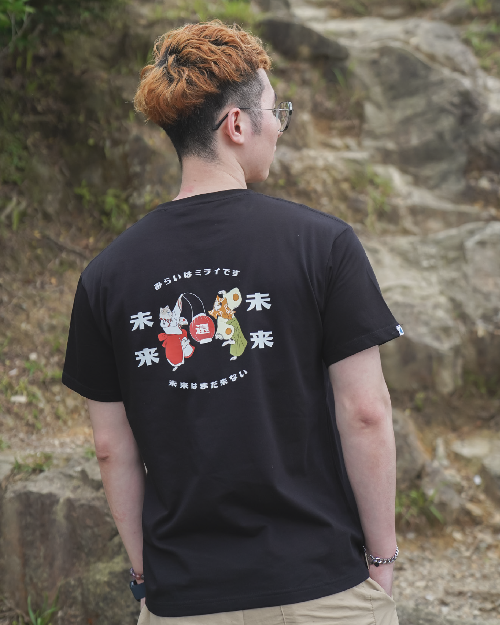 Man wearing the black Dancing Cat Tee (Night Festival Tee) outdoors at Grandmama Store in Hong Kong.