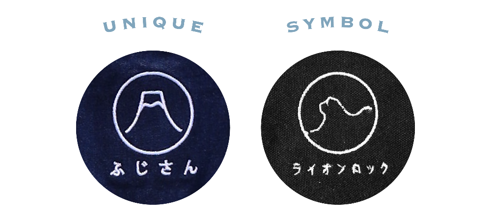 Side-by-side circular swatches showing white embroidered Mount Fuji and Lion Rock emblems with Japanese text on navy and black denim for the Kamon Denim Dress-Fujisan at Grandmama Store in Hong Kong.