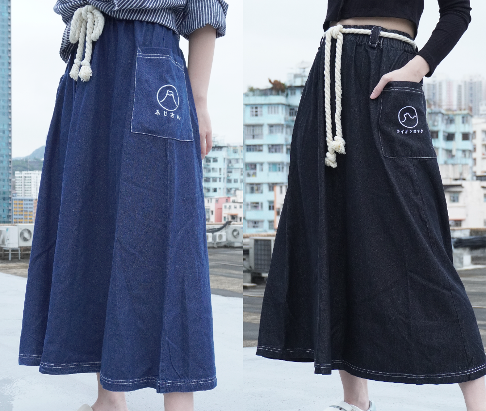 Side-by-side comparison of the Kamon Denim Dress in Navy Blue Fujisan and Black Lion Rock at Grandmama Store in Hong Kong.