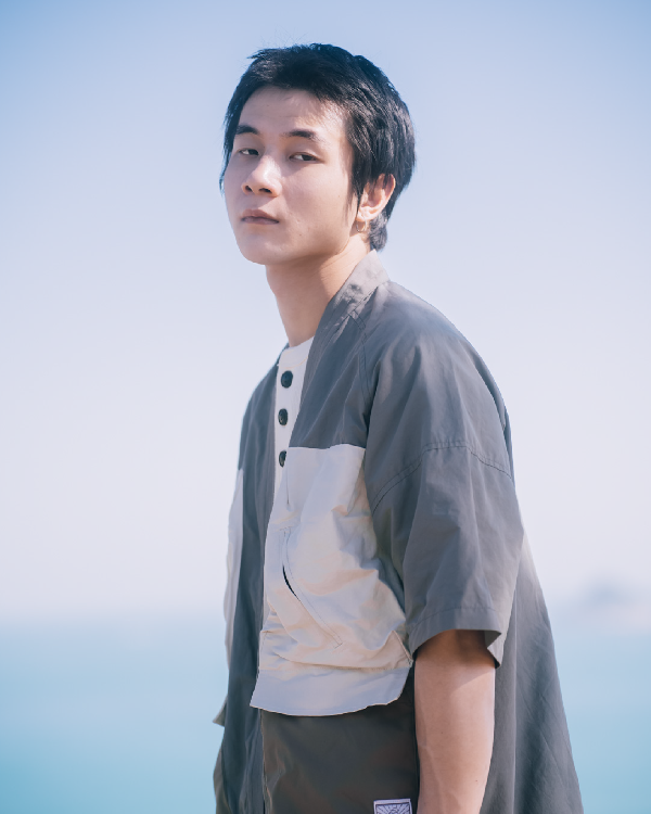 Side-profile view of Morikawa Yama Kimono Jacket by the sea at Grandmama Store in Hong Kong.