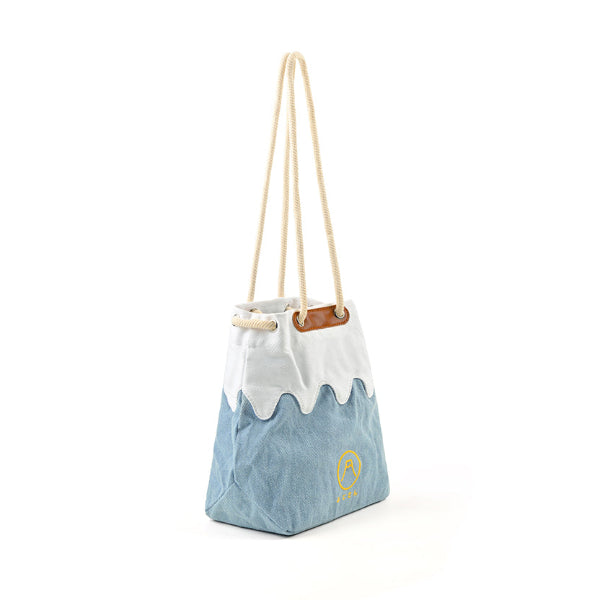 Three-quarter side angle view of the light blue Mt. Fuji sake bag at Grandmama Store in Hong Kong.
