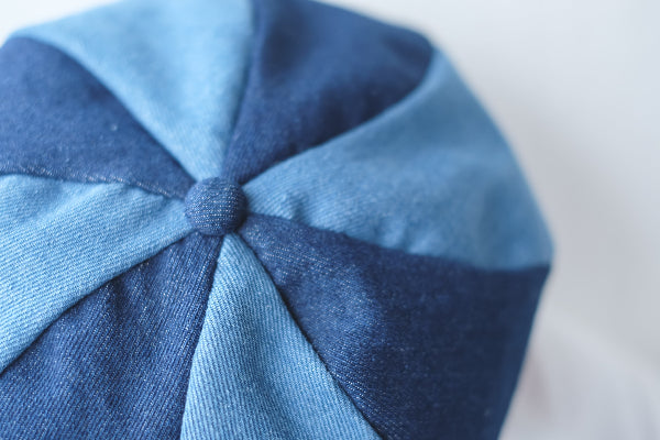 Top-down detail of the multi-panel Sunshine Beret in shades of blue at Grandmama Store in Hong Kong.