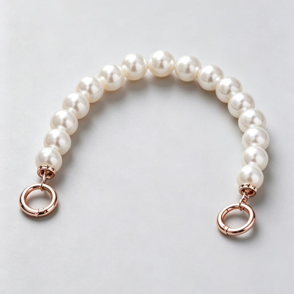 White pearl bead purse strap accessory with gold ring clasps at Grandmama Store in Hong Kong.