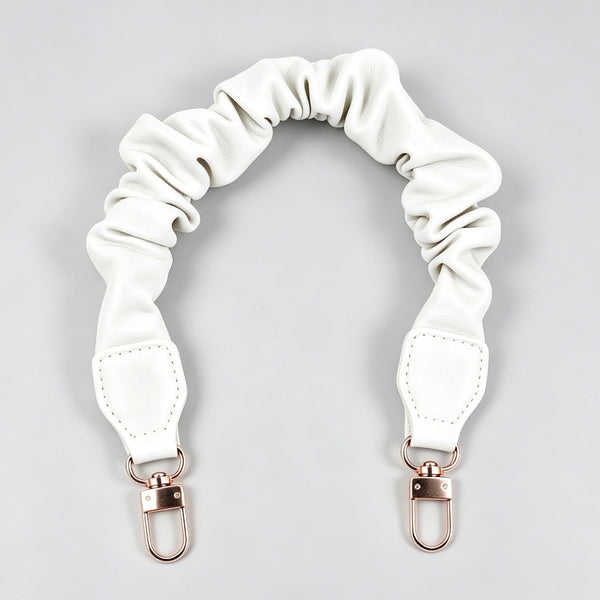 White ruffled scrunchie leather purse strap accessory with gold clasps at Grandmama Store in Hong Kong.