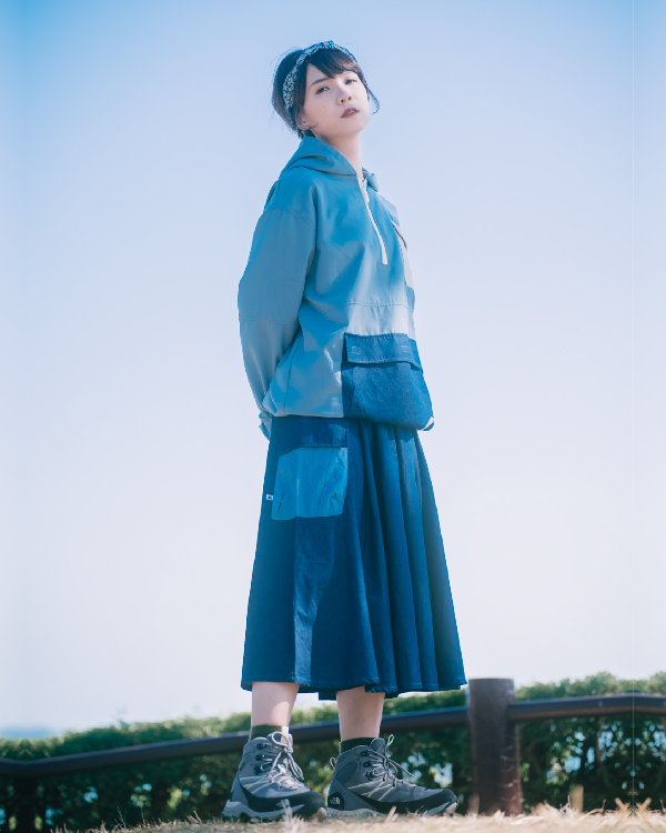 Woman wearing the dark blue Yama Ocean Pocket Dress outdoors at Grandmama Store in Hong Kong.