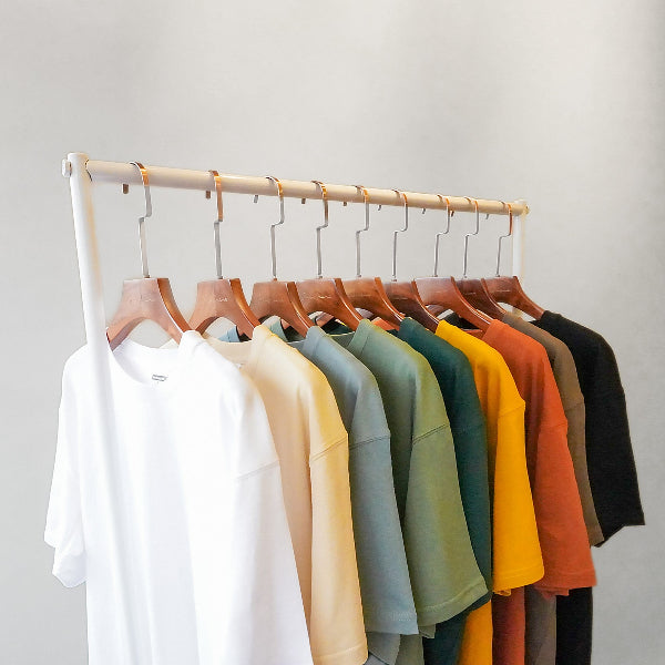 Yama Basic Color Tees hanging on a minimalist display rack at Grandmama Store in Hong Kong.