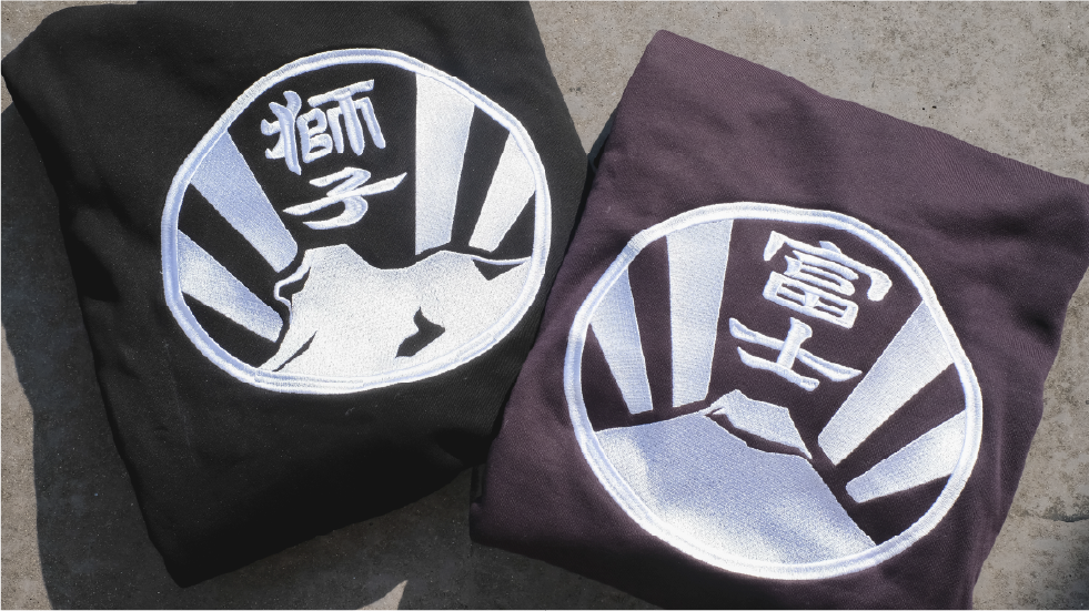 folded-black-hoodies-with-lion-rock-and-mt-fuji-kamon-patches-Kamon-Hoodie-Hong-Kong-Kwun-Tong-Grandmama-store