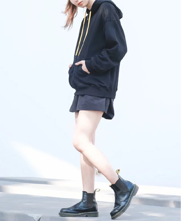 woman-in-shorts-and-boots-wearing-black-kamon-hoodie-side-Kamon-Hoodie-Hong-Kong-Kwun-Tong-Grandmama-store