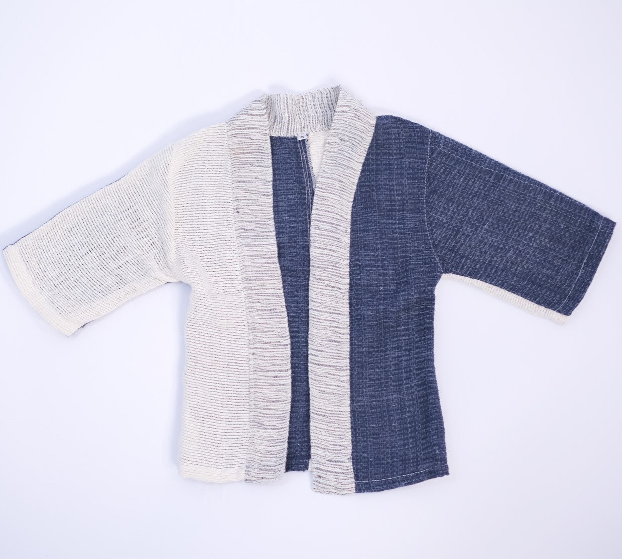 Front flat lay view of the Hand-cranked Kids Kimono jacket in Mt. Fuji blue at Grandmama Store in Hong Kong.
