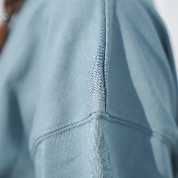 Light blue Yama Basic Color Tee shoulder seam detail at Grandmama Store in Hong Kong.